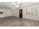 Bright living room with tiled floor, ceiling fan, and ample natural light at 2808 W Lawrence Rd, Phoenix, AZ 85017