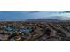 Aerial view of neighborhood with nearby lake and mountain views at 2810 N 112Th Ln, Avondale, AZ 85392