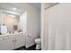 Bright bathroom featuring a white vanity, toilet, and tiled floor at 2810 N 112Th Ln, Avondale, AZ 85392