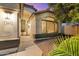 Charming front entrance with stylish door, manicured landscaping, and walkway at 2810 N 112Th Ln, Avondale, AZ 85392