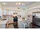 Modern kitchen features stainless steel appliances, white cabinets, and sleek countertops at 2810 N 112Th Ln, Avondale, AZ 85392