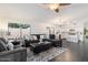 Comfortable living area features a large sectional couch, a ceiling fan and lots of light at 2810 N 112Th Ln, Avondale, AZ 85392