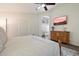 Main bedroom features a ceiling fan, a dresser, and a walk-in bathroom at 2810 N 112Th Ln, Avondale, AZ 85392