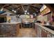 Outdoor kitchen with a built-in grill, bar, and ample counter space under a covered patio at 2810 N 112Th Ln, Avondale, AZ 85392