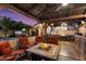 Cozy outdoor space with a fire pit, lounge chairs and an outdoor kitchen at 2810 N 112Th Ln, Avondale, AZ 85392