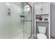 Tiled shower with glass door, complemented by toilet and decorative shelving at 2821 S Skyline -- # 135, Mesa, AZ 85212