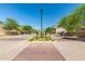 Community entrance leading to homesites, featuring beautiful landscaping and greenery at 2821 S Skyline -- # 135, Mesa, AZ 85212