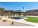 Community gazebo with picnic and grilling areas for residents surrounded by beautiful landscaping at 2821 S Skyline -- # 135, Mesa, AZ 85212