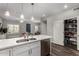 Bright, open kitchen with island, stainless steel dishwasher, and walk-in pantry at 2821 S Skyline -- # 135, Mesa, AZ 85212