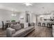 Open-concept living room connected to a dining area and kitchen, perfect for entertaining and modern living at 2821 S Skyline -- # 135, Mesa, AZ 85212