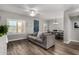 Relaxing living room featuring a comfortable gray couch and a stylish dining area with lots of natural light at 2821 S Skyline -- # 135, Mesa, AZ 85212