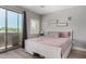 Bright bedroom with shuttered windows, balcony access, and neutral decor at 2821 S Skyline -- # 135, Mesa, AZ 85212