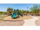 Community playground with a slide, benches, and shade providing a great space for families at 2821 S Skyline -- # 135, Mesa, AZ 85212