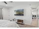 Open Primary bedroom showcasing TV, a modern cabinet, and access to other rooms in the home at 3009 E Whitton Ave, Phoenix, AZ 85016