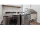 Functional laundry room equipped with modern washer, dryer, and dog grooming area for convenience at 3009 E Whitton Ave, Phoenix, AZ 85016