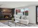 Inviting living room featuring a cozy fireplace, modern decor, and ample natural light at 3009 E Whitton Ave, Phoenix, AZ 85016
