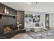 Bright living room with a charming fireplace, cozy seating, and stylish decor at 3009 E Whitton Ave, Phoenix, AZ 85016