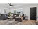Comfortable living room with large windows, a cozy seating area, and modern decor at 3009 E Whitton Ave, Phoenix, AZ 85016