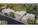 Stunning aerial view of a modern home on golf course with a flat roof, and a two-car garage at 3033 E Claremont Ave, Phoenix, AZ 85016