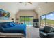 Large main bedroom with vaulted ceilings, access to the outdoor pool and ample natural light at 3033 E Claremont Ave, Phoenix, AZ 85016