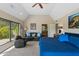 Main bedroom with a comfortable seating area, high vaulted ceiling, and outdoor view at 3033 E Claremont Ave, Phoenix, AZ 85016