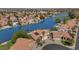 Aerial shot showcasing a waterfront home with solar panels and a lush yard at 3112 N 110Th Ave, Avondale, AZ 85392