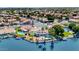 Aerial view of a waterfront home with a pool and lush landscaping in a residential area at 3112 N 110Th Ave, Avondale, AZ 85392