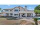 Backyard featuring a large patio, stone furniture, and pool views at 3112 N 110Th Ave, Avondale, AZ 85392