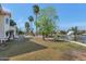 Large backyard with mature trees, pool, lakeside views and ample space for recreation at 3112 N 110Th Ave, Avondale, AZ 85392