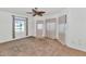 Bright bedroom with a ceiling fan, neutral tones, and natural light at 3112 N 110Th Ave, Avondale, AZ 85392