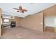 Spacious carpeted bedroom with a ceiling fan and a fireplace, offering a cozy retreat at 3112 N 110Th Ave, Avondale, AZ 85392