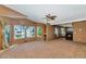 Bedroom with views of the lake and boats, a ceiling fan, and a fireplace at 3112 N 110Th Ave, Avondale, AZ 85392