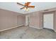 Bedroom featuring a ceiling fan, neutral walls, and carpeted floors at 3112 N 110Th Ave, Avondale, AZ 85392