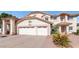 Two-story home showcasing a three-car garage, neutral color palette, and well-maintained landscaping at 3112 N 110Th Ave, Avondale, AZ 85392