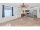 Bright kitchen area featuring tiled floor, white walls, and stainless appliances at 3112 N 110Th Ave, Avondale, AZ 85392