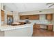 Well-lit kitchen featuring wood cabinets, stainless steel appliances, and ample counter space at 3112 N 110Th Ave, Avondale, AZ 85392
