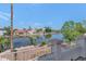 Scenic lake view from the home featuring lush landscaping and clear blue skies at 3112 N 110Th Ave, Avondale, AZ 85392