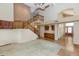 Inviting living space featuring a staircase, built-in cabinets, and a combination of carpet and tile flooring at 3112 N 110Th Ave, Avondale, AZ 85392