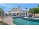 Backyard view featuring a pool, patio, and meticulously kept landscaping at 3112 N 110Th Ave, Avondale, AZ 85392
