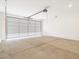 Spacious garage with concrete floor and closed overhead door, ready for vehicles and storage at 323 S San Fernando Ln, Casa Grande, AZ 85194