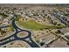 Panoramic aerial view of a well-planned community featuring green spaces, desert landscaping, and convenient roadways at 3247 N Loma Vis, Mesa, AZ 85213