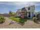 Large backyard with playground, green turf, and well-maintained landscaping at 3247 N Loma Vis, Mesa, AZ 85213