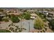 Aerial shot of community basketball court, shaded playground, and green spaces perfect for recreation and leisure at 3247 N Loma Vis, Mesa, AZ 85213