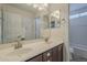 Bathroom featuring dual sinks, vanity, and access to a toilet room at 3247 N Loma Vis, Mesa, AZ 85213