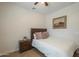 Cozy bedroom featuring a bed, bedside table, and a decorative painting, creating a relaxing and inviting space at 3247 N Loma Vis, Mesa, AZ 85213