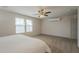 Sunlit bedroom with two windows, ceiling fan, and ample space for furniture at 3247 N Loma Vis, Mesa, AZ 85213
