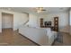 Open concept living room featuring hardwood floors, a ceiling fan, and a comfortable couch at 3247 N Loma Vis, Mesa, AZ 85213