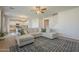 Bright living room featuring a comfortable sectional sofa, stylish ceiling fan, and seamless flow into a modern kitchen at 3247 N Loma Vis, Mesa, AZ 85213