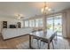 Spacious living room and dining area featuring natural light, an open layout, and modern finishes throughout at 3247 N Loma Vis, Mesa, AZ 85213