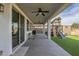 Covered patio features a ceiling fan and view of the backyard playset at 3247 N Loma Vis, Mesa, AZ 85213